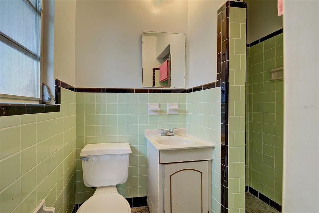 A picture of the second bathroom with a shower.