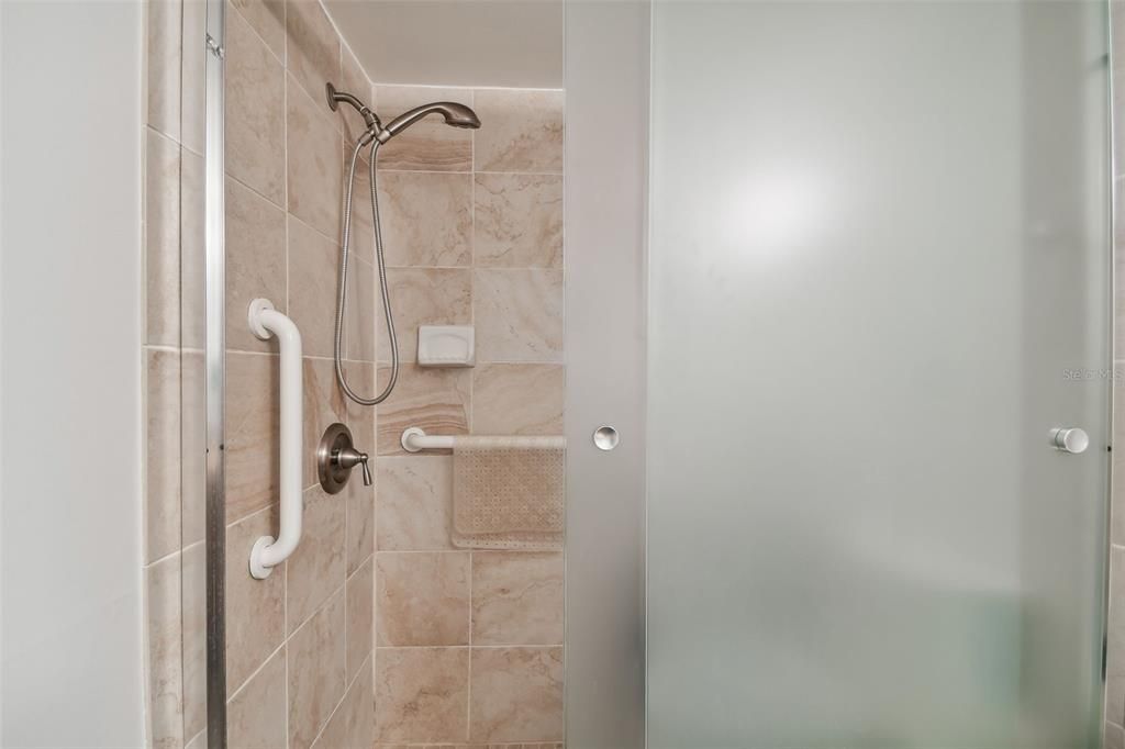 Step-in shower in hall bathroom.