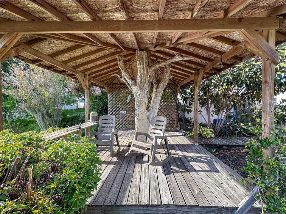 Love the tree for the post in this gazebo.