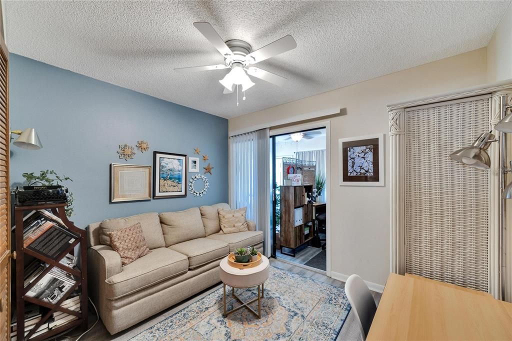 Bedroom 2 with Home office/Sunroom beyond sliding doors