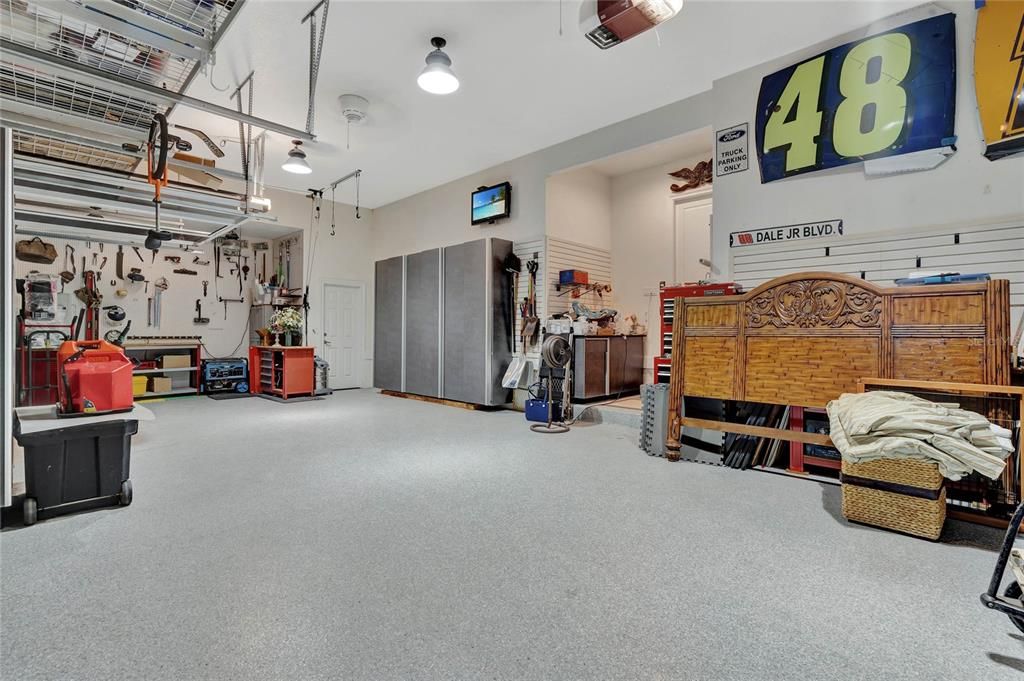 Garage with Epoxy Flooring, Storage and Screen Door