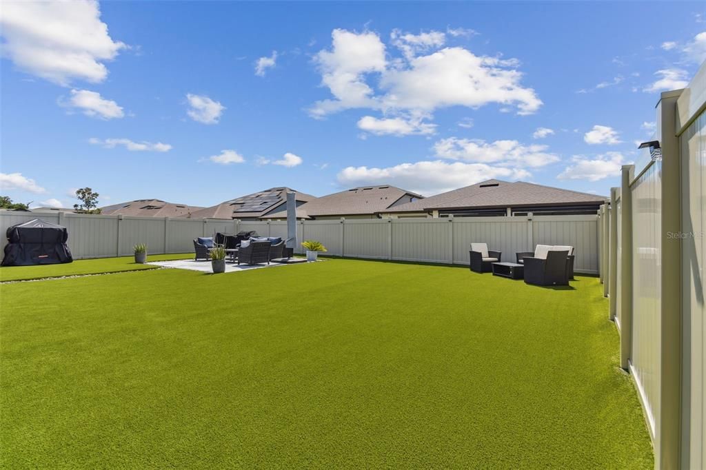 Whole backyard is covered with artificial turf