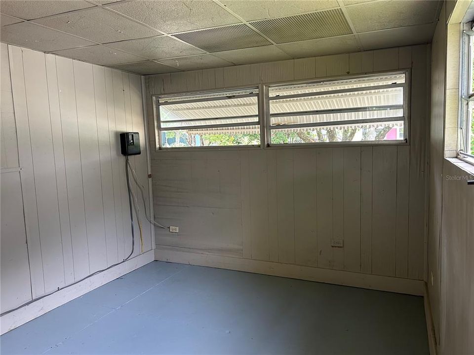 Laundry room with hook-ups and storage closet.