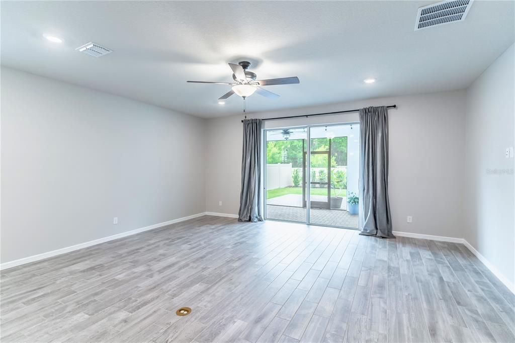 Living Room with Direct Access to Screened-In Paver Patio