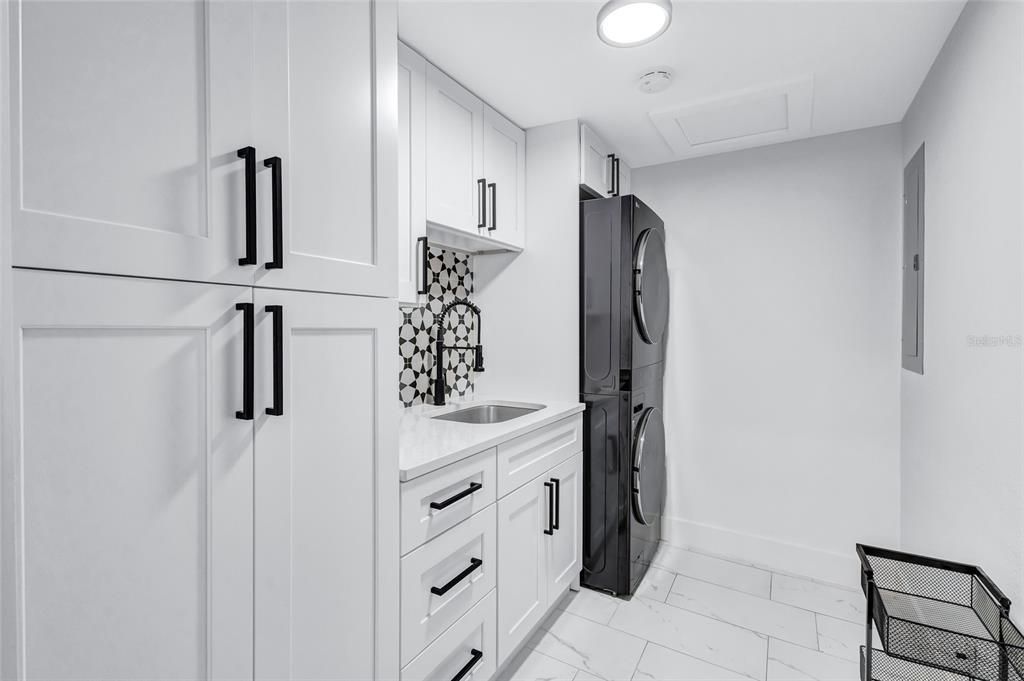 Laundry room and pantry with tankless water heater