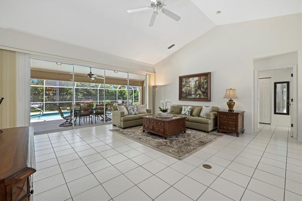 Living Room with sliders out the pool area