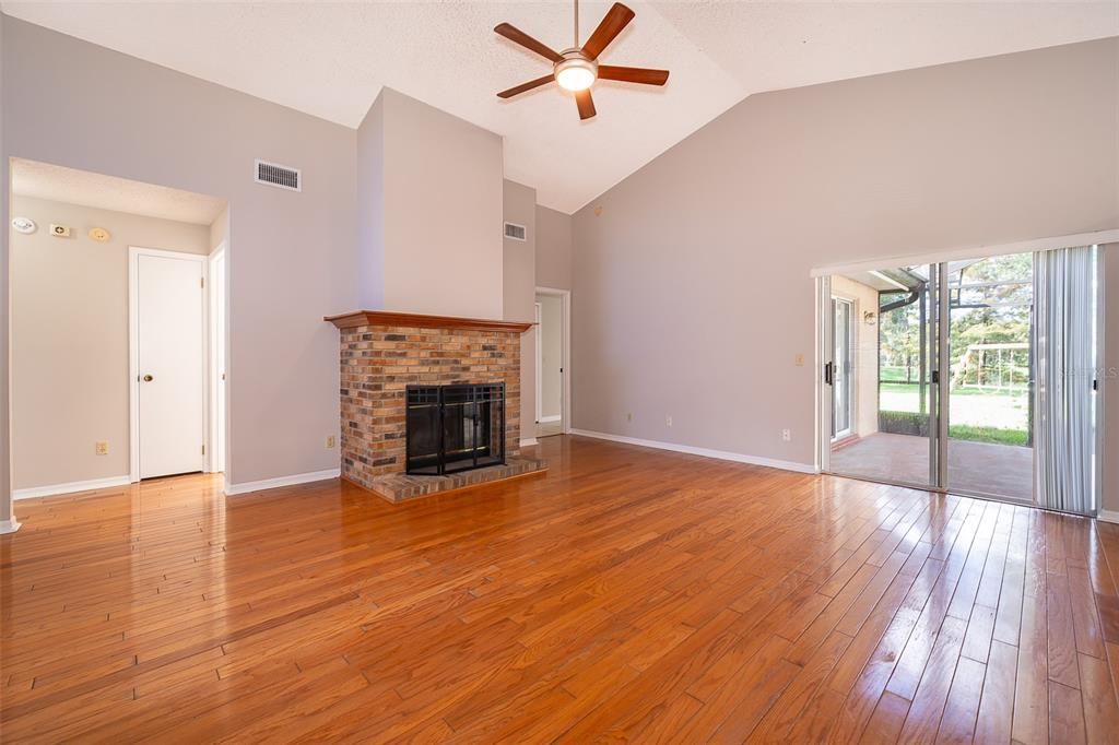 Living Room/Wood Burning Fireplace/Screened Patio