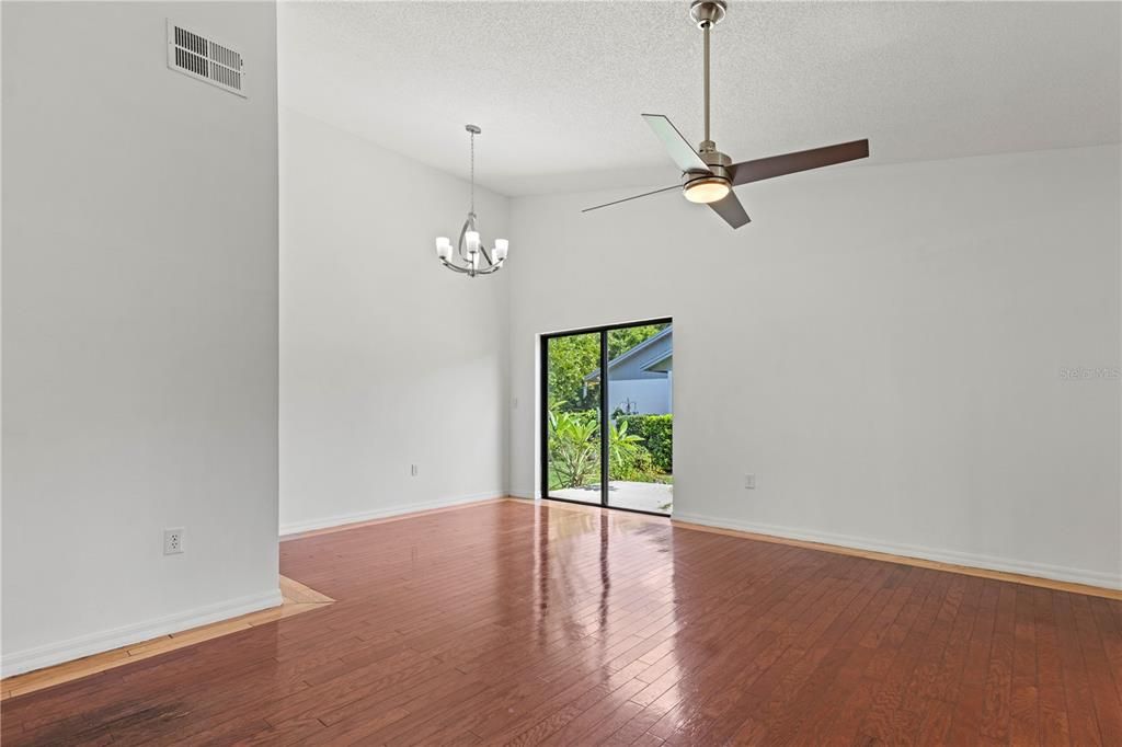 Great room with view of dining area and side porch