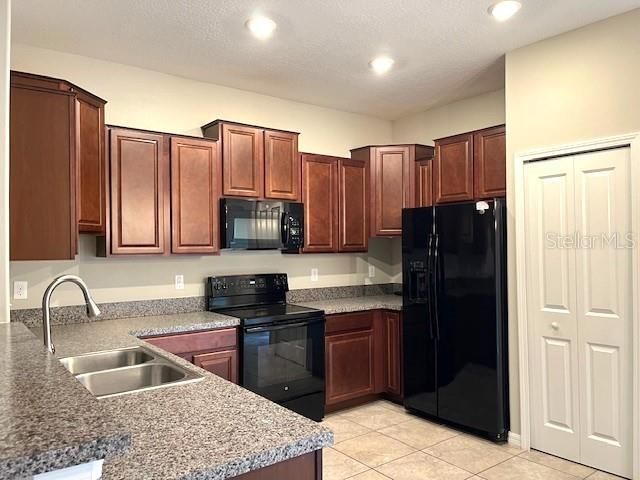 Kitchen with wood cabinets