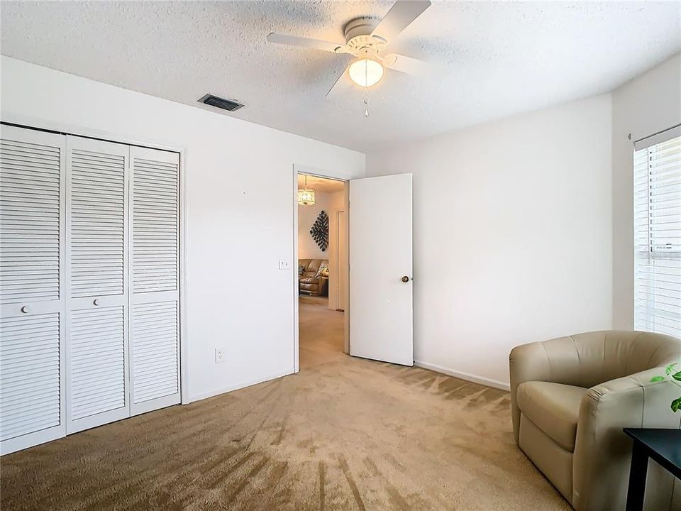 Bedroom 2, built in closet and room entry door