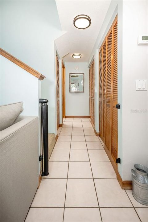 Hallway leading to master bedroom and laundry closet
