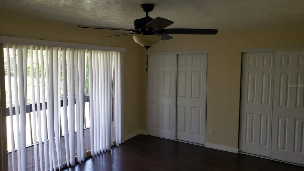 Primary bedroom with balcony