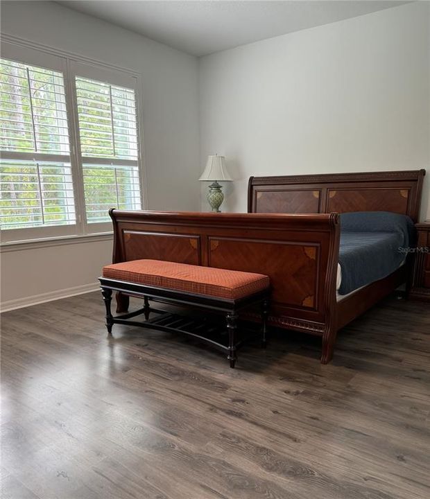 Primary bedroom with triple windows