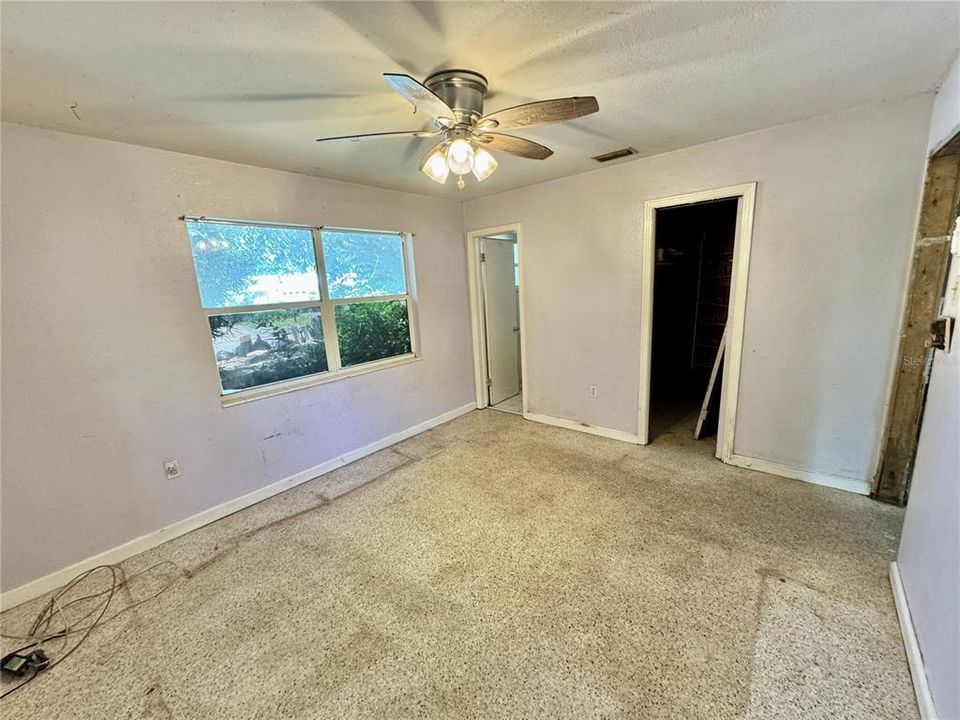 Primary Bedroom with Walk-In Closet and Half Bath