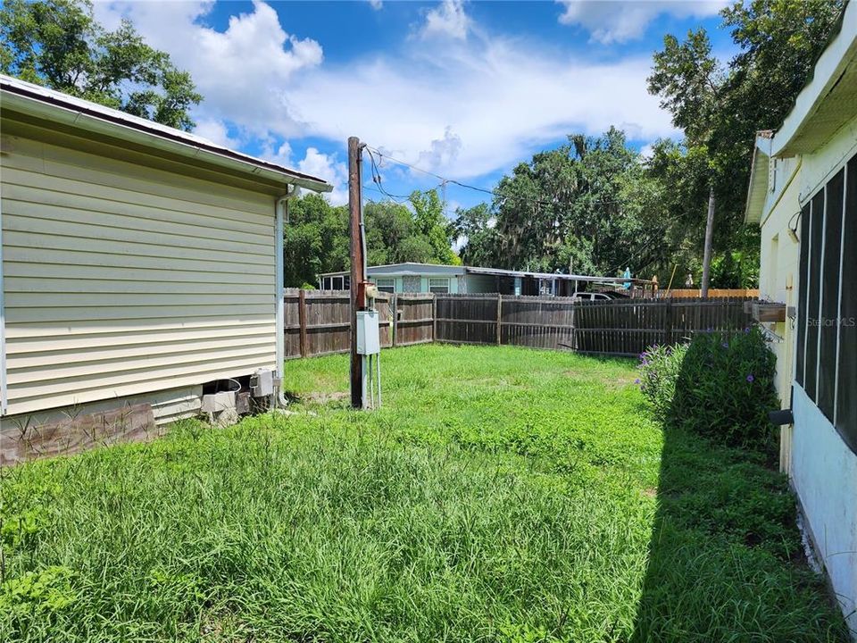 REAR OF MOBILE AND FRONT OF EXTRA BLDG