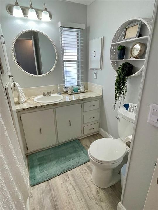 Hall bath with a full tub and shower, very nicely updated!