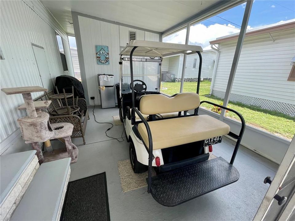 Screened lanai, nic3 furniture for this room, just put away in the shed. Gold cart goes with the home!