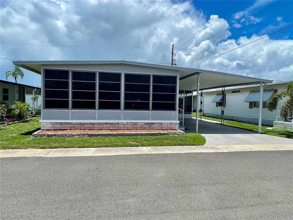 Front view. Florida room up front. Roof-over installed with 2 years