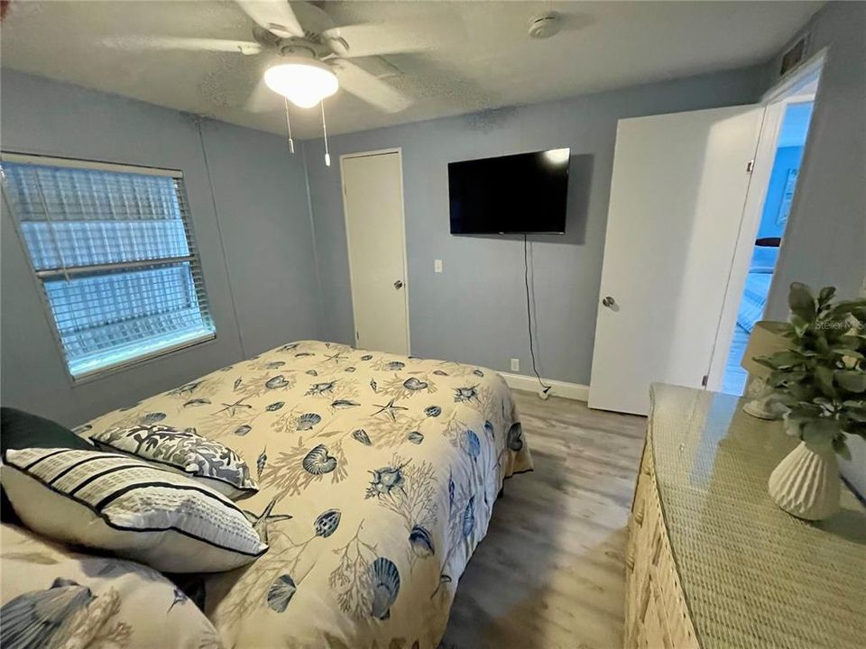 2nd bedroom with it's own TV and a walk-in closet