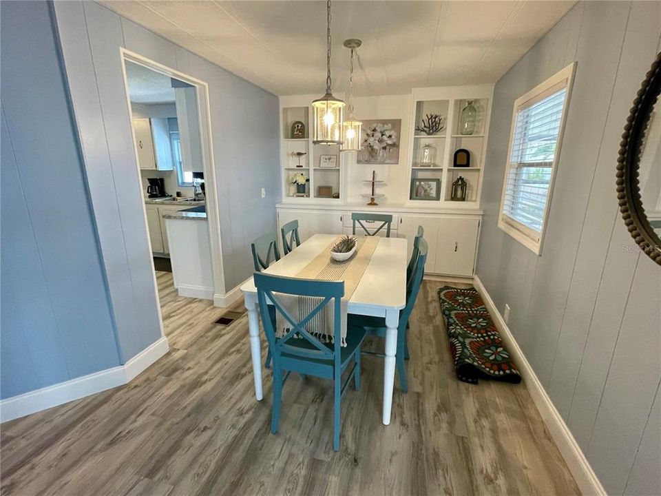 Dining - (extra rug on side of table is for the Lanai). Fresh paint through out. Newer stylish furniture.