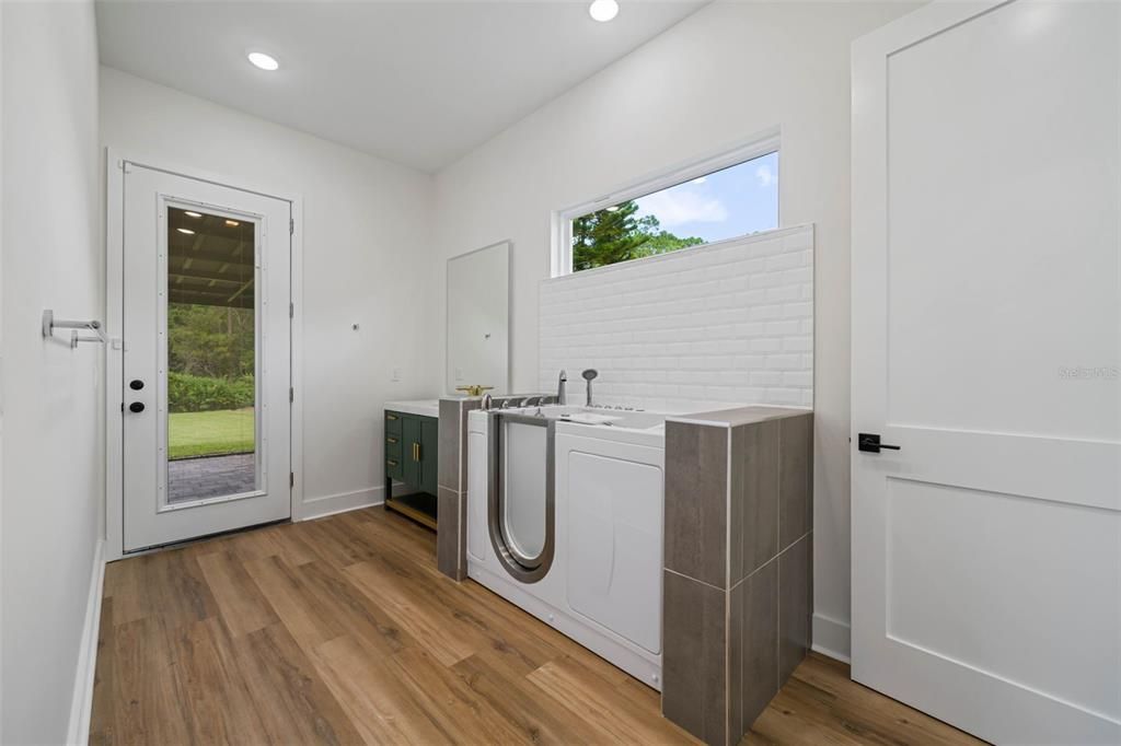 Suite #2 bathroom with walk-in jacuzzi and enclosed toilet room