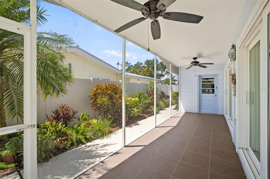 Enjoy your screen enclosed porch off the living/dining area, with hurricane impact sliding doors.