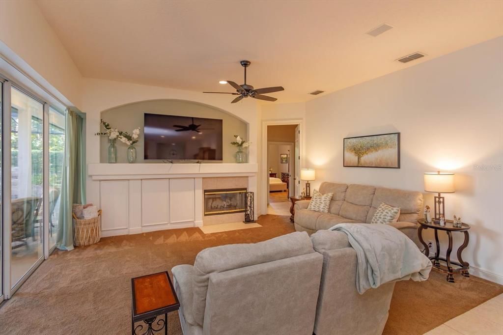 Family room with wood burning fireplace