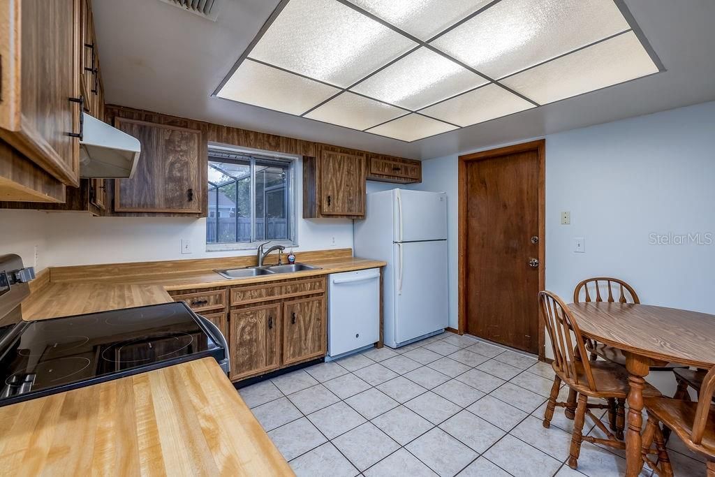 Tiled Kitchen well cared for with eat in space