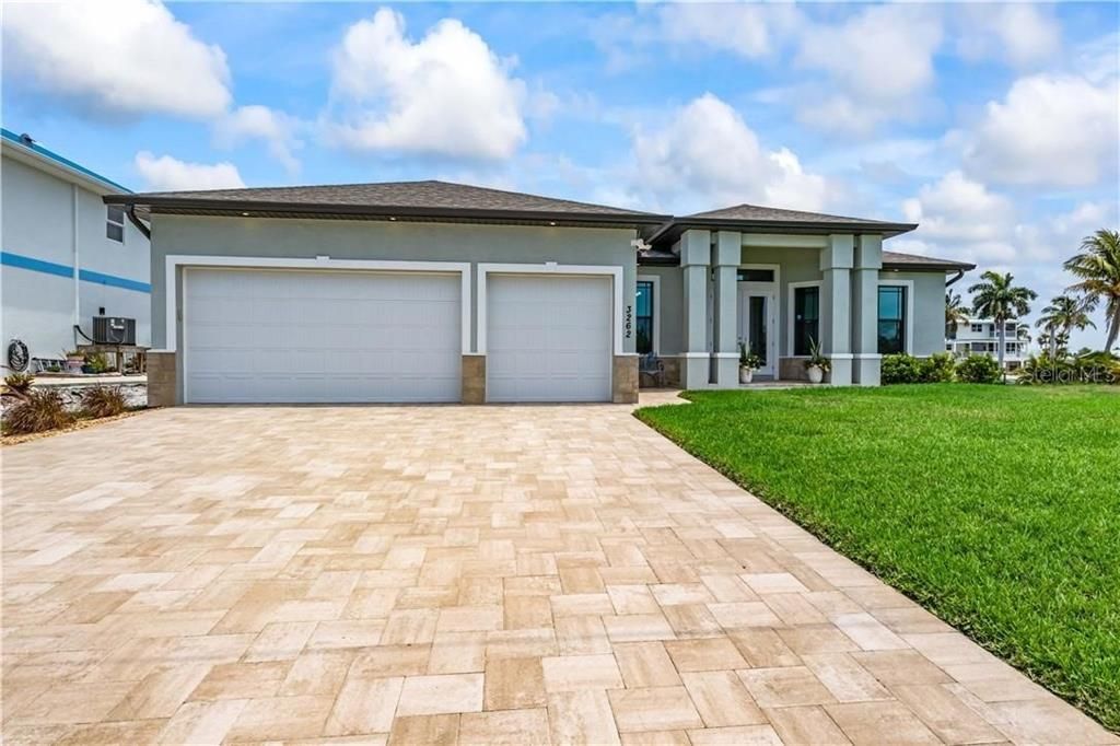 Welcome home!  PARADISE!!!  Right here at your fingertips!  Custom three bedroom and den home with three bathrooms -STUNNING location just 3 lots down from open waters!