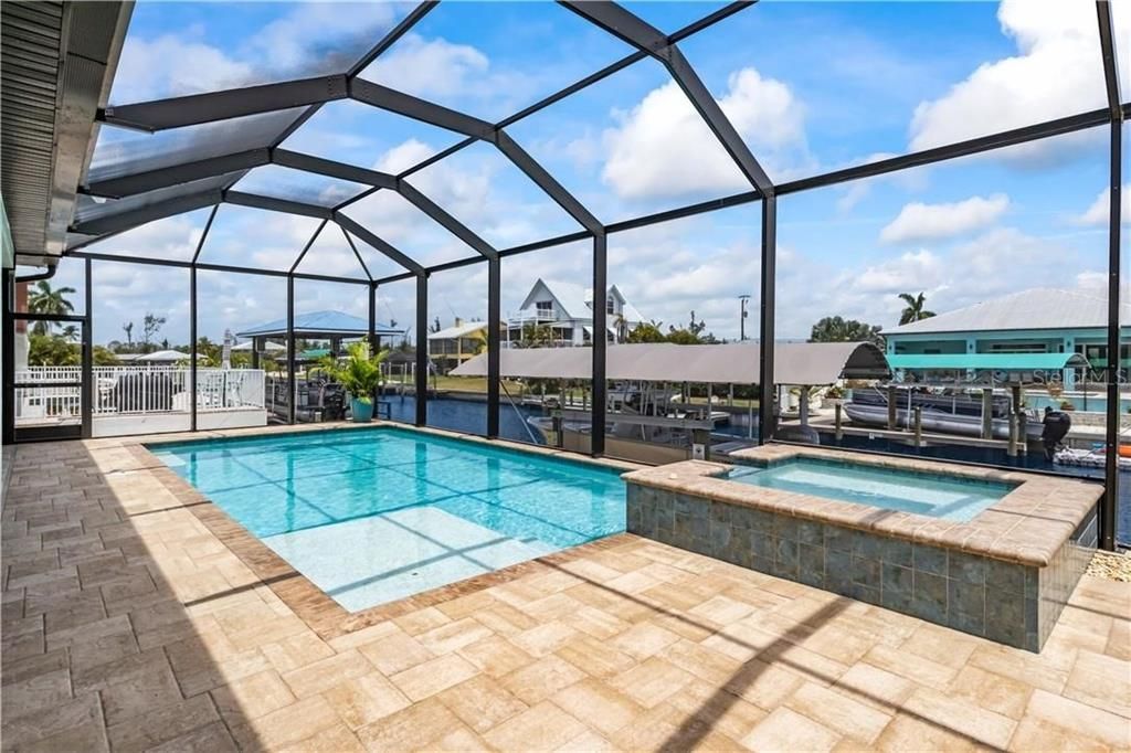 Pool and spa - enjoy this beautiful SWFL living year round - sparkling pool with sun ledge for those summer days and nights and a heated spa for those cool winter evenings!