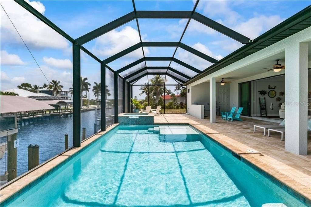 View of pool and spa looking down the Manatee Canal towards the open waters!