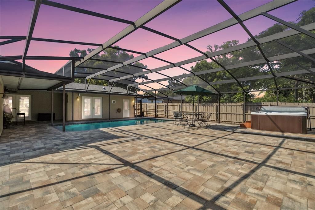 brick paver patio in rear surrounding pool