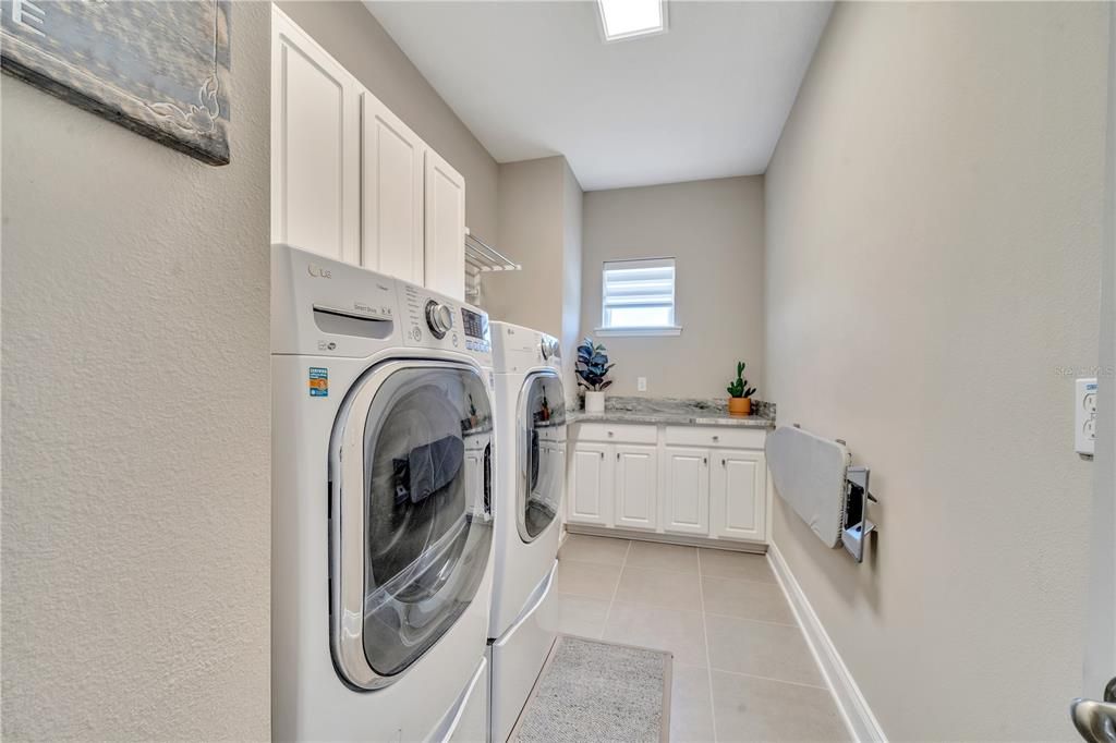 Laundry Room with Granite Counter Tops and Sink