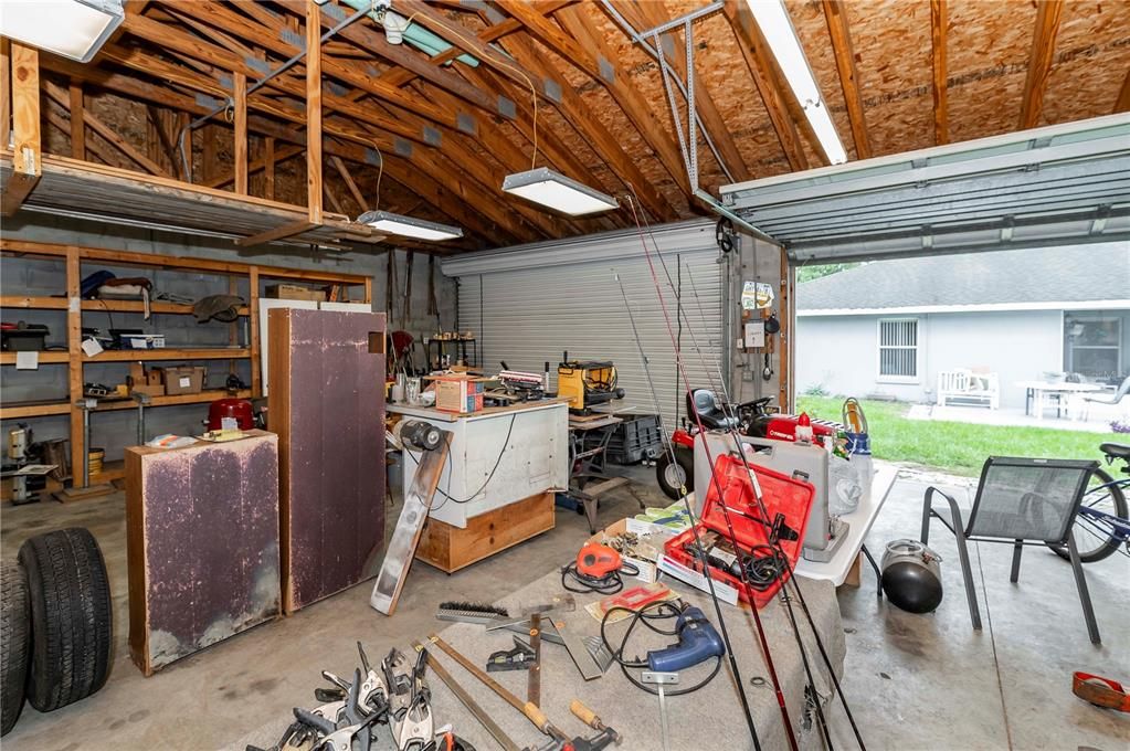 Detached 30'x40' garage with two double doors and storage racks