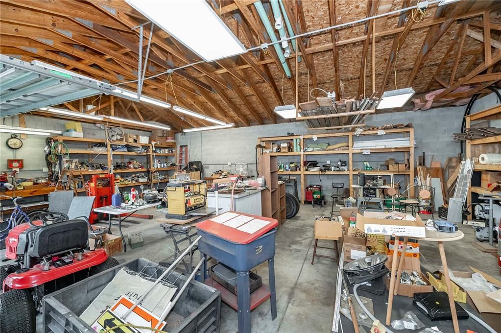 Detached 30'x40' garage with two double doors and storage racks