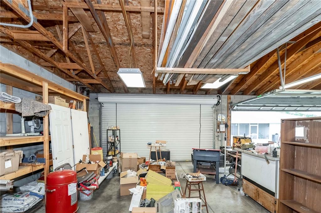 Detached 30'x40' garage with two double doors and strorage racks