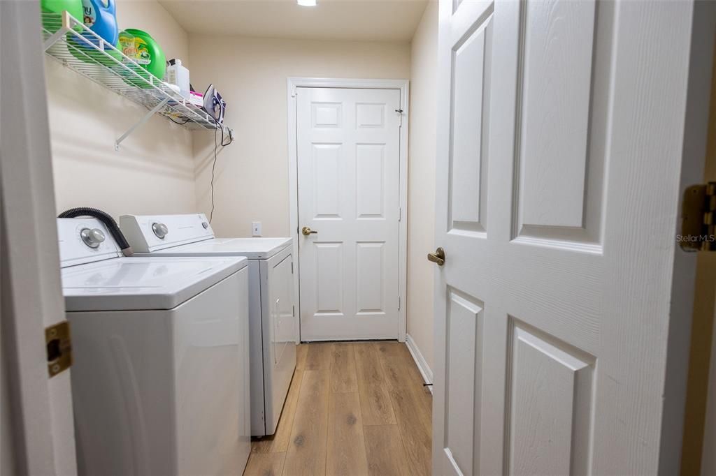 Laundry room leading to garage