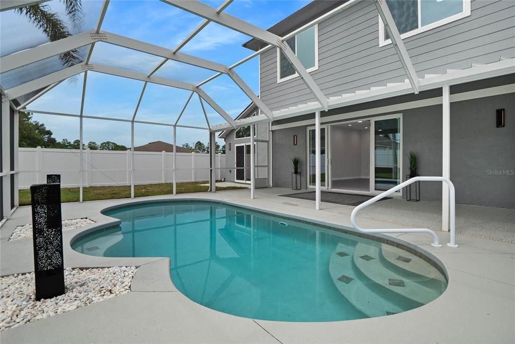 Large pool area complete with huge space for entertainment under roof