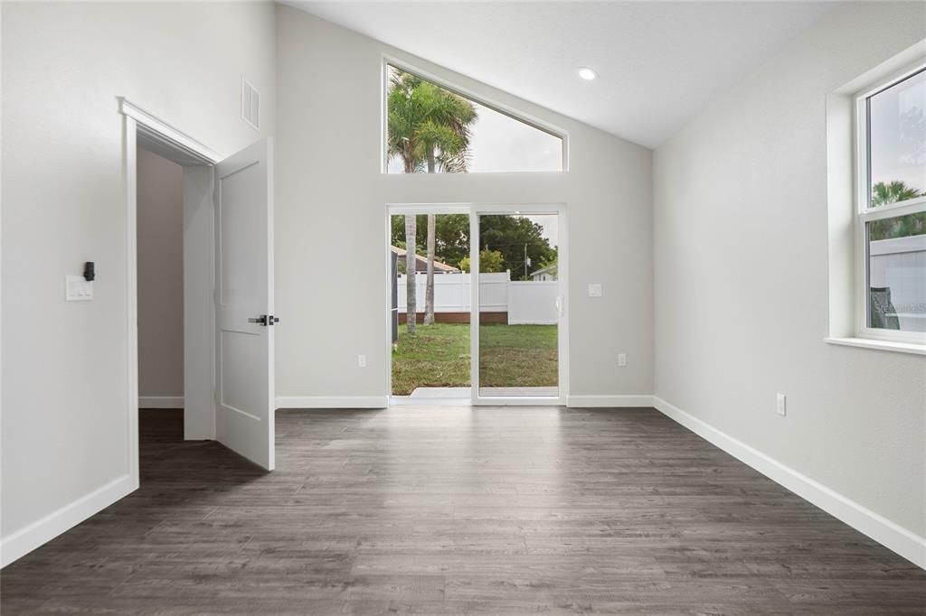 Tall ceiling and lots of light in the main floor bedroom