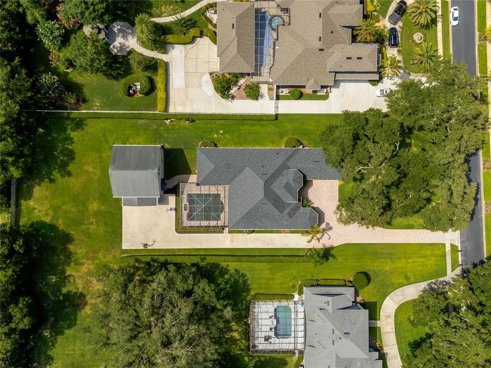 Aerial view of the main house and guest house located on one acre in the gated community of Cardinal Pointe.