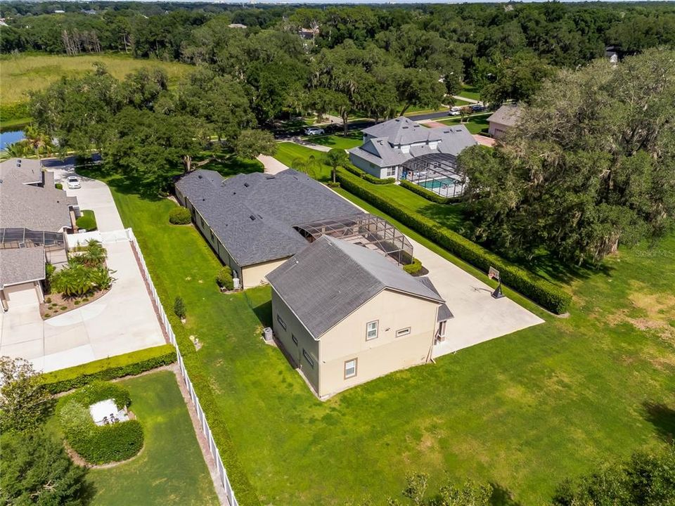 Aerial view of the main house and guest house located on one acre in the gated community of Cardinal Pointe.