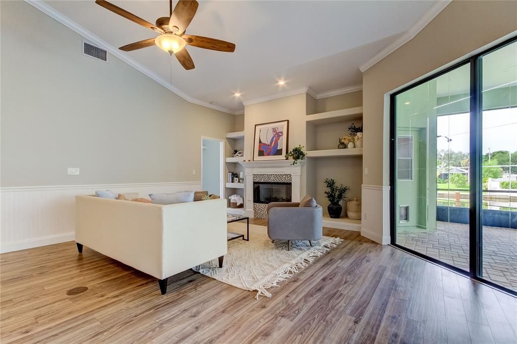 Living room has wood burning fireplace.