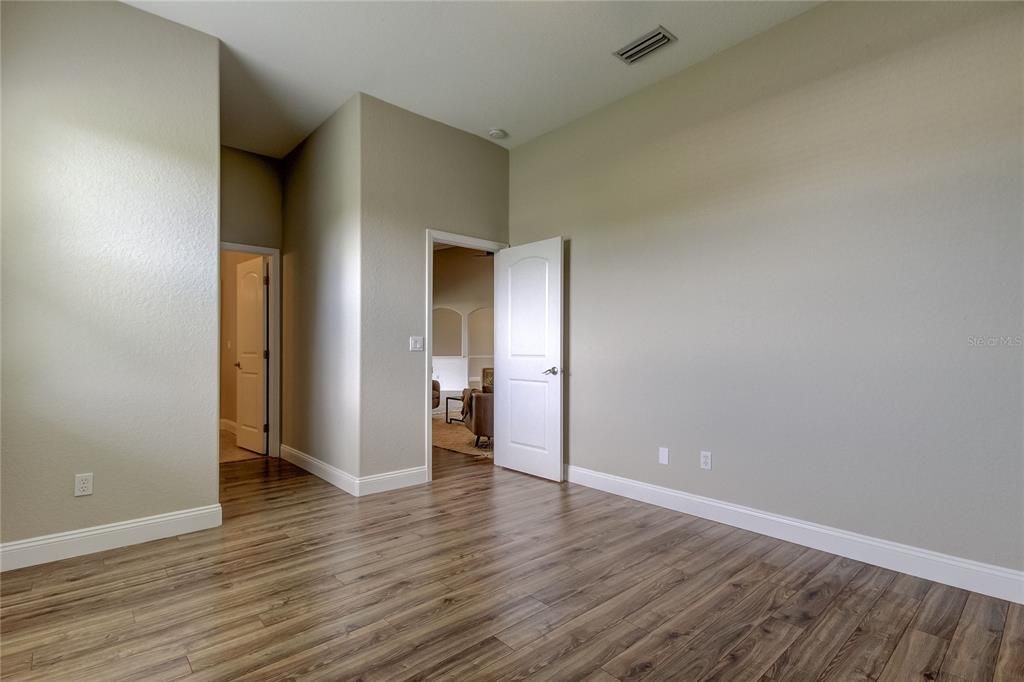 Bedroom 2, doorway to en-suite/pool bath