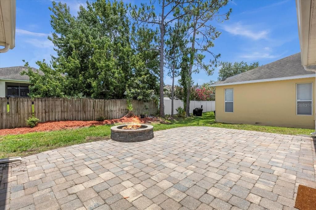 pavers in back yard with fire pit