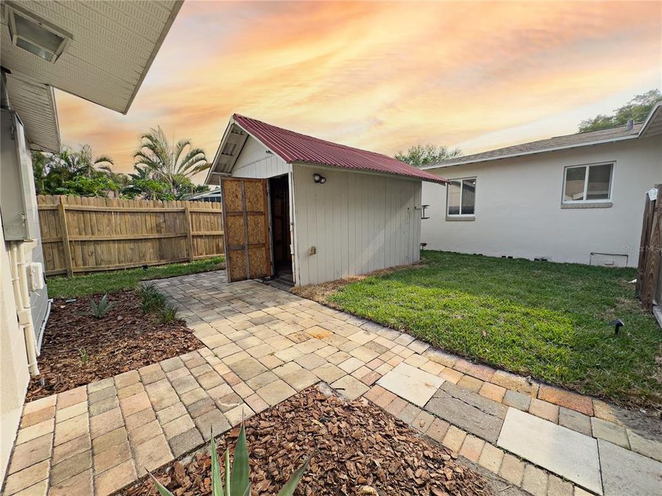 View of workshop and the pavers throughout the property.