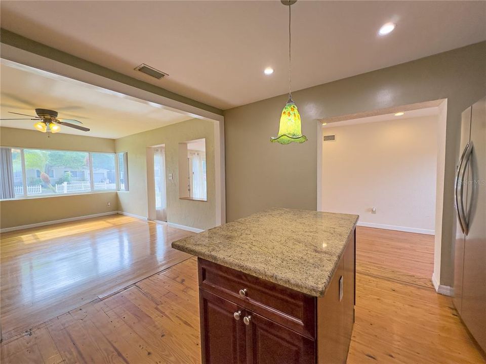 View of Kitchen, living room to the right and the great room straight ahead...