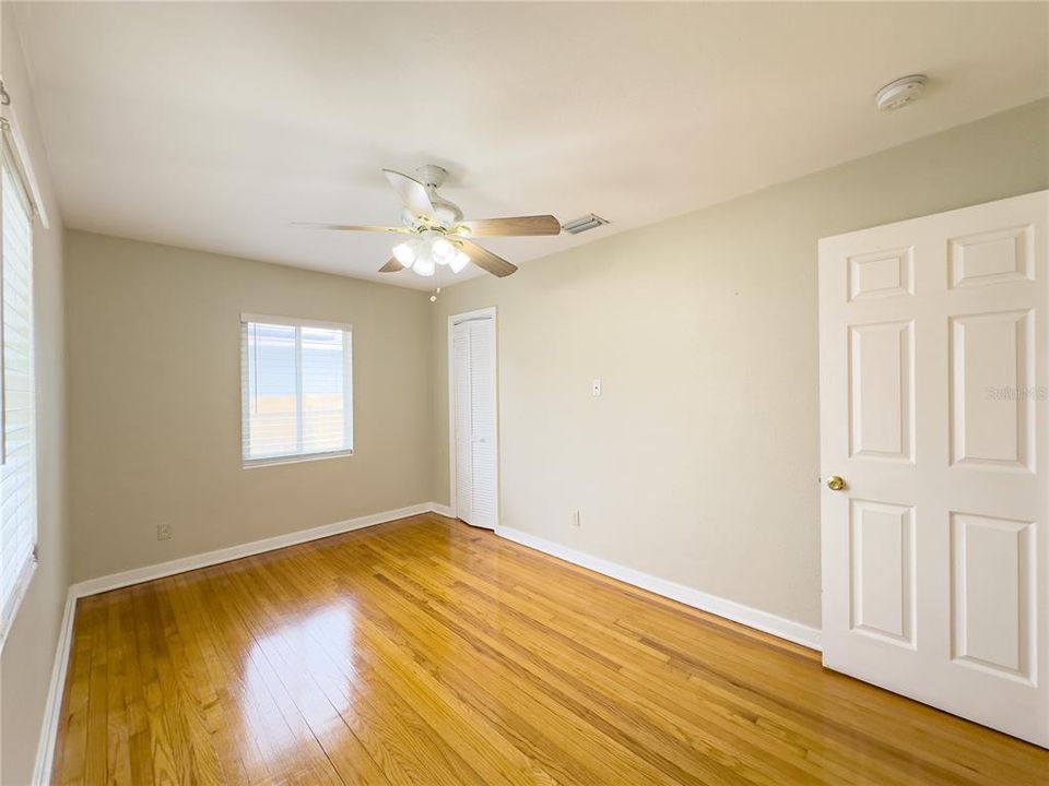 2nd bedroom with beautiful polished wood floors