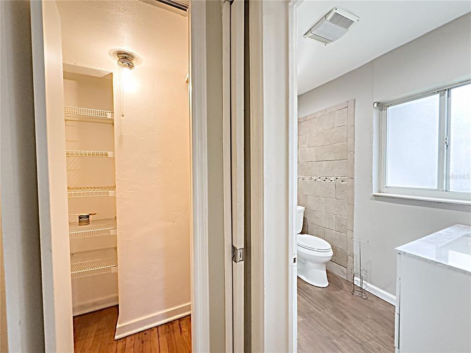 View of main bathroom and hall linen closet