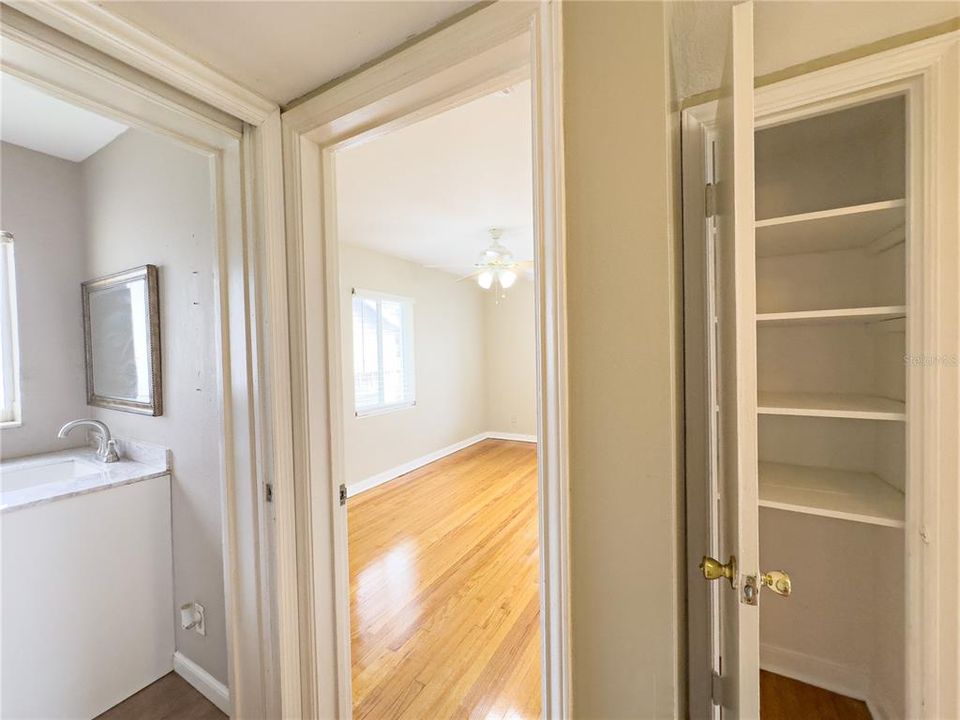 View of main entrance to master bathroom, master bedroom and additional hall closet for plenty of storage.