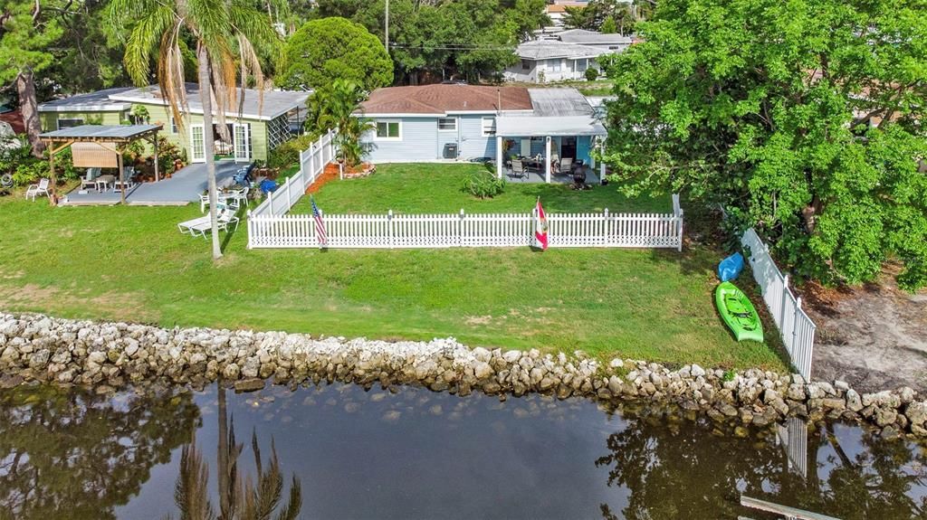 The property line extends into the creek allowing for waterfront improvements like dock and davits, floating dock ect...